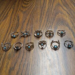 New Women's Eleven Piece Turquoise And Silvertone Ring Set.